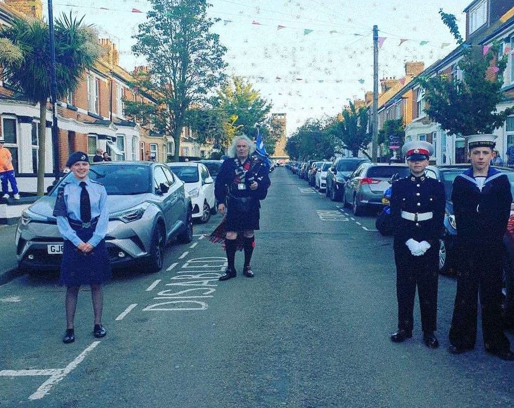 Neighbours clapped, saluted and marched for carers tonight in Gillingham. Picture: Clare Hush