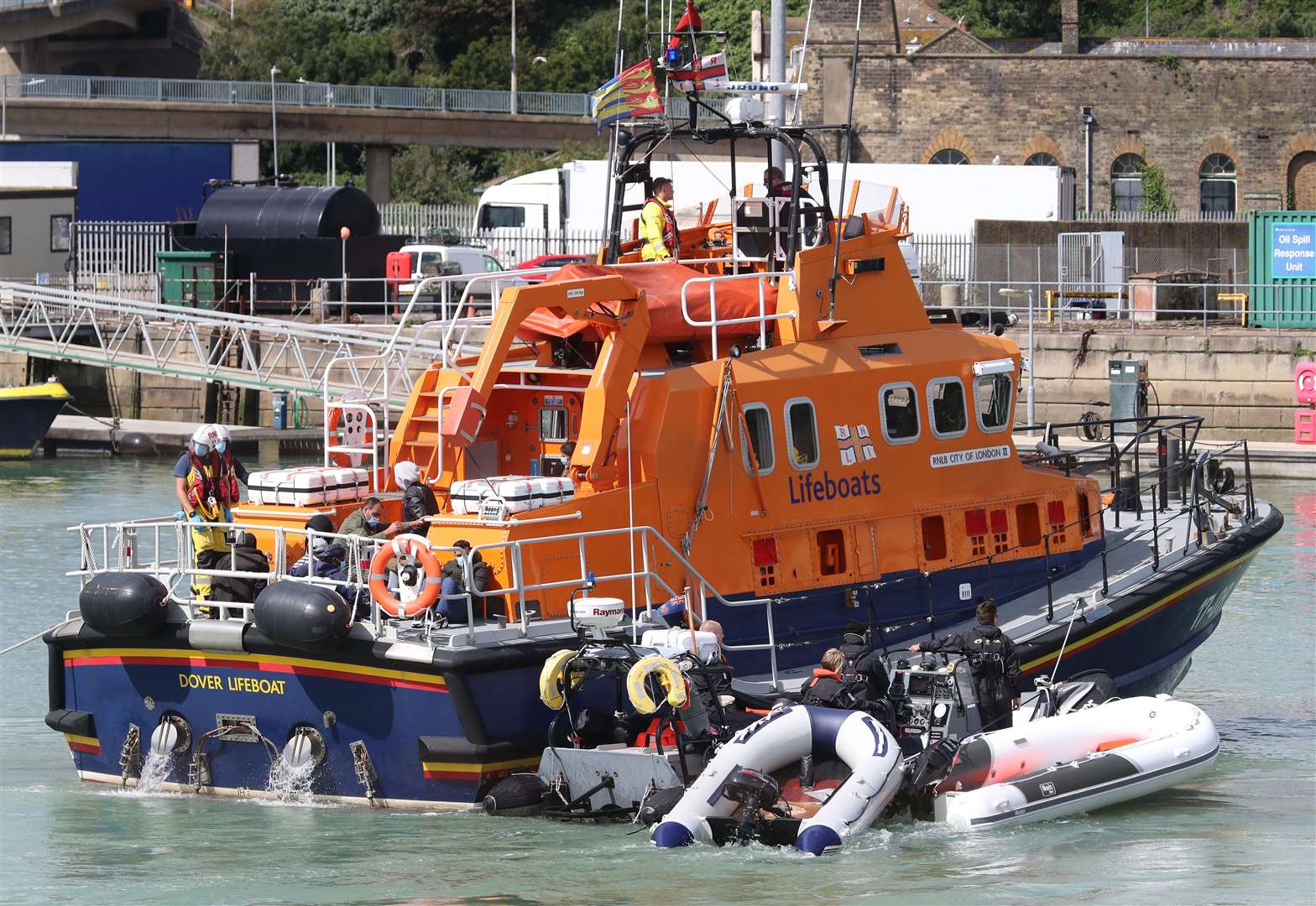 The Dover Lifeboat and Border Force officers tow small boats into Dover, Kent (Gareth Fuller/PA)