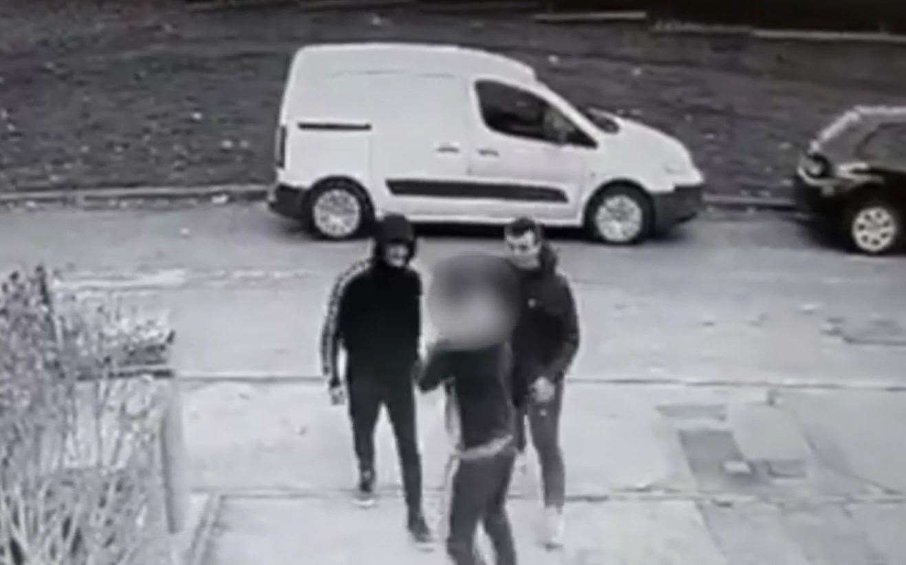 The two thugs approach the teenager in Faversham in the CCTV