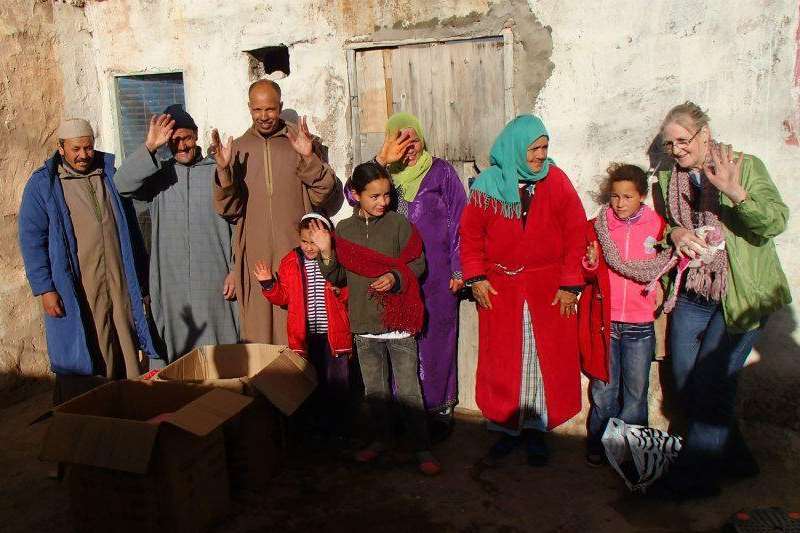 Denise Carter-Evans (far right) with some of the recipients of the warm clothing in Morocco