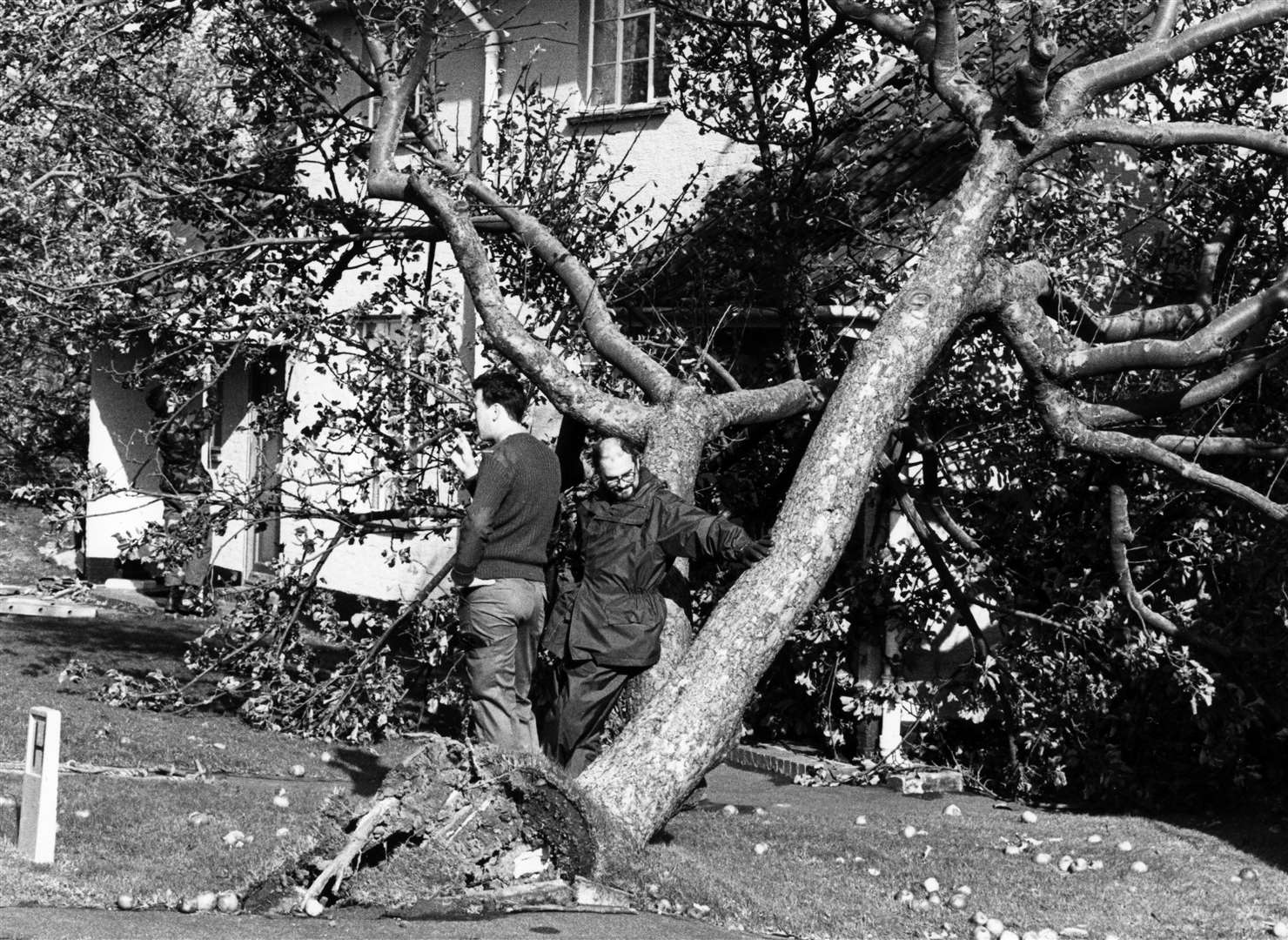 Residents survey the damage in Orchard Drive, Kennington, Ashford. Picture: Steve Salter