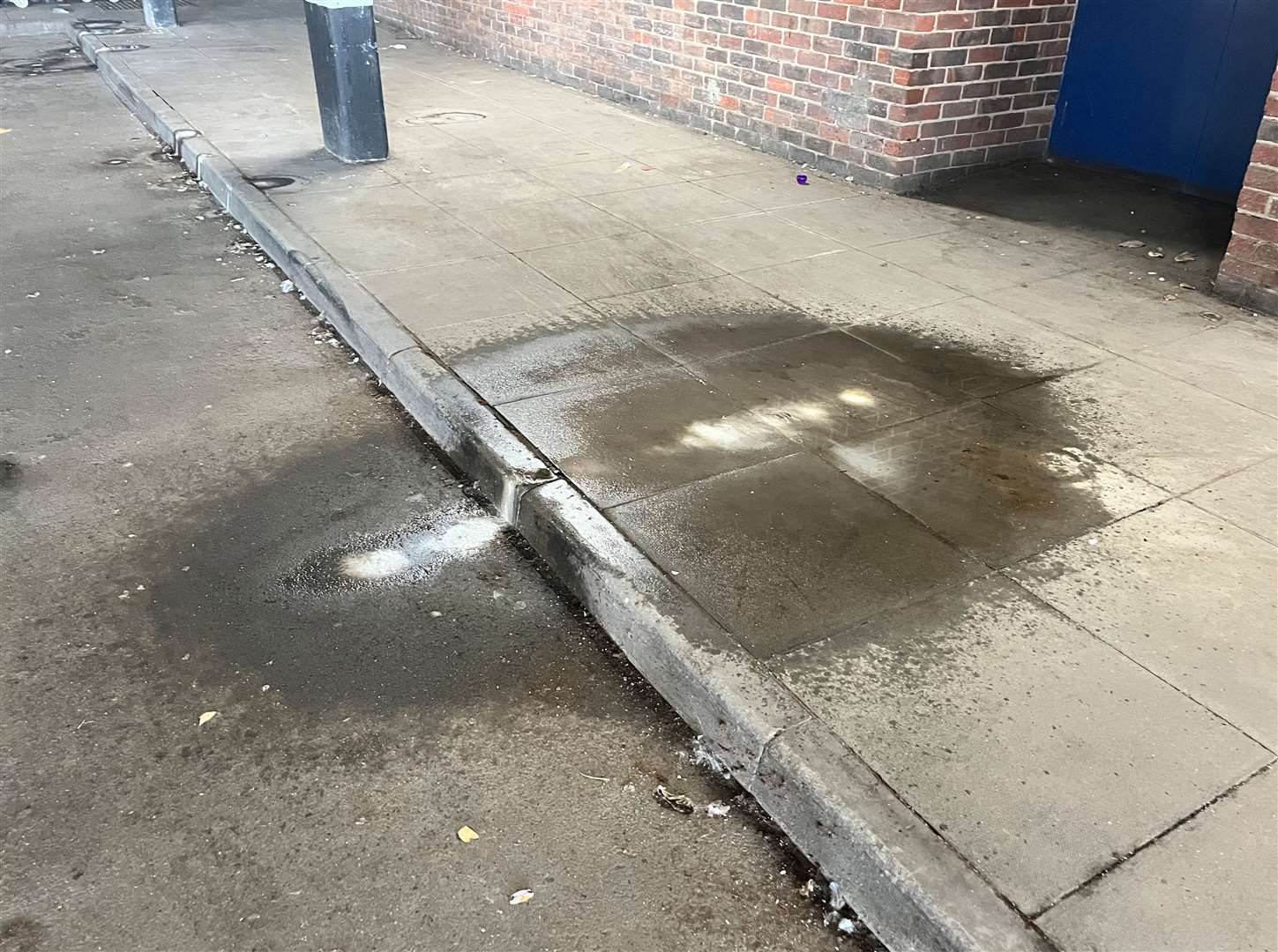 There are lots of wet patches on the floor of the car park