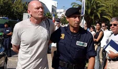 Garry Mann is escorted into court in Portugal. Picture: PA