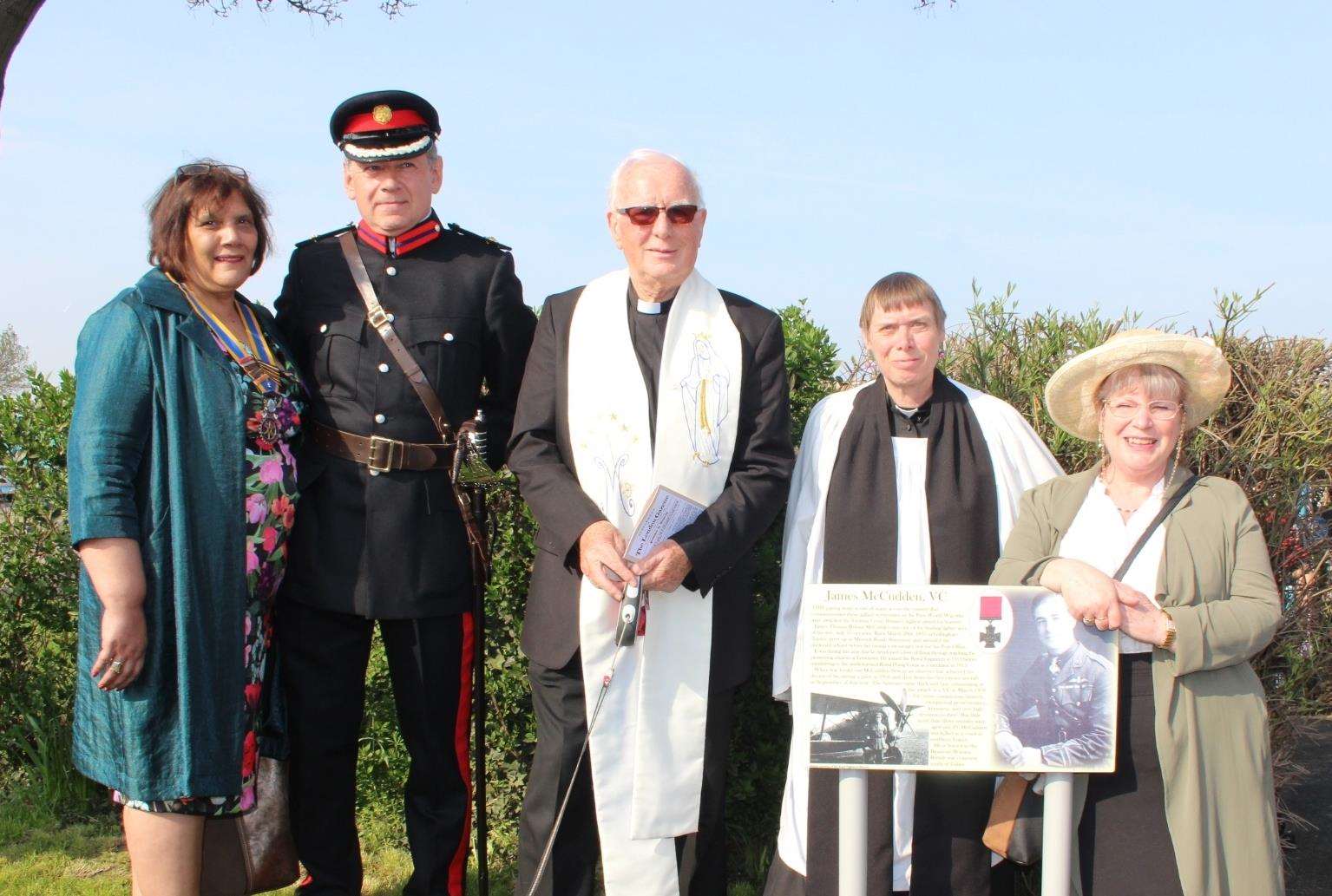 Deputy Lord Lieutenant of Kent Paul Auston with, from the left, Jenny Hurkett, Father Frank Moran, the Rev Jeanette Mclaren and Janys Thornton at the unveiling of the Capt James McCudden VC paving stone at Sheerness War Memorial