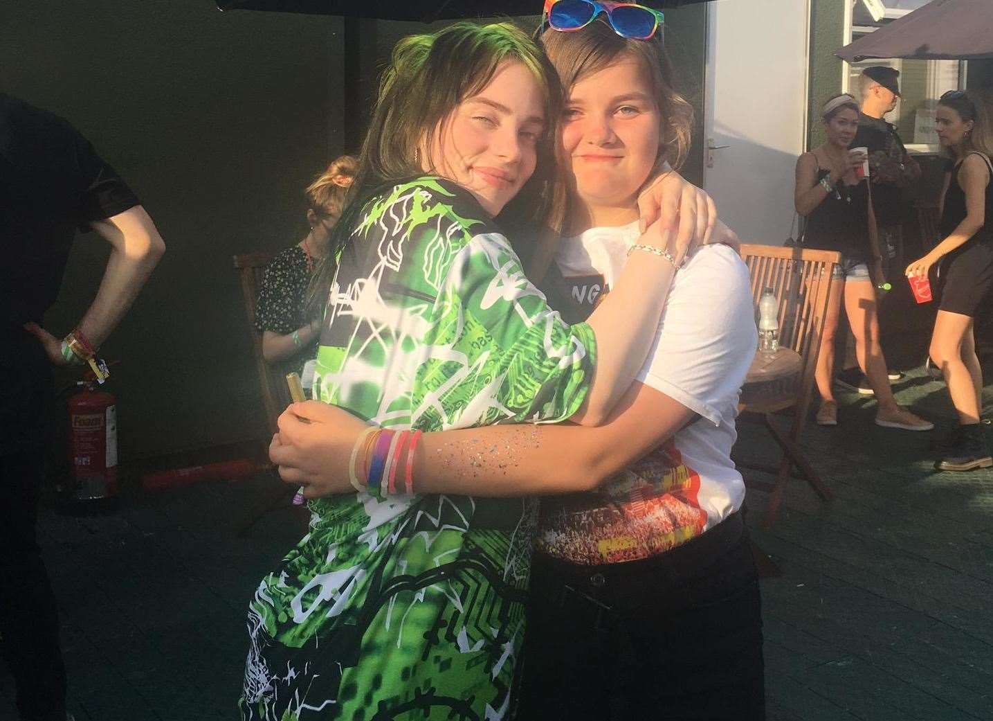Maddie Simon hugs Billie Eilish backstage at Reading Festival