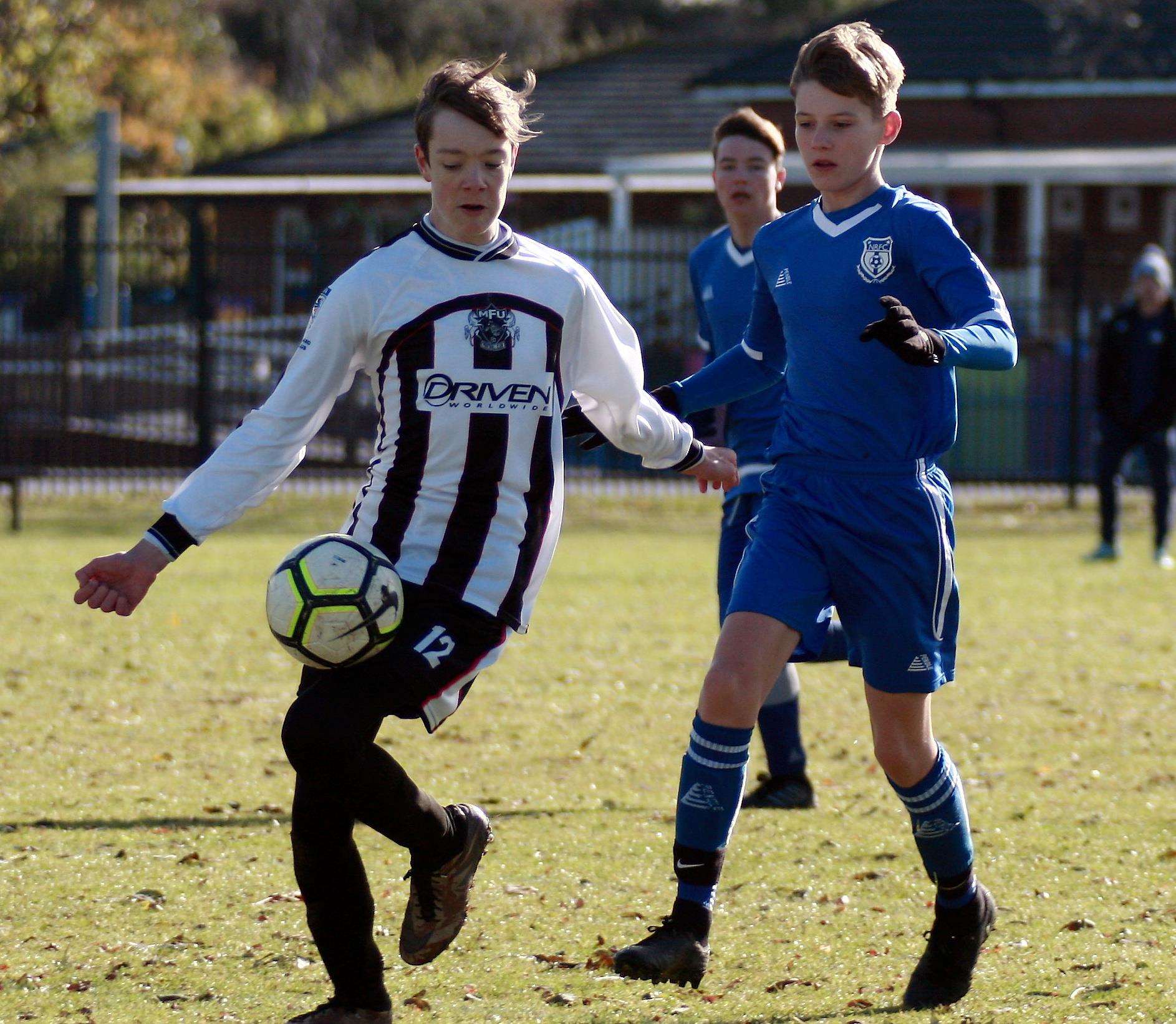 Milton & Fulston under-16s (white) battle New Road with Division 2 points at stake Picture: Phil Lee