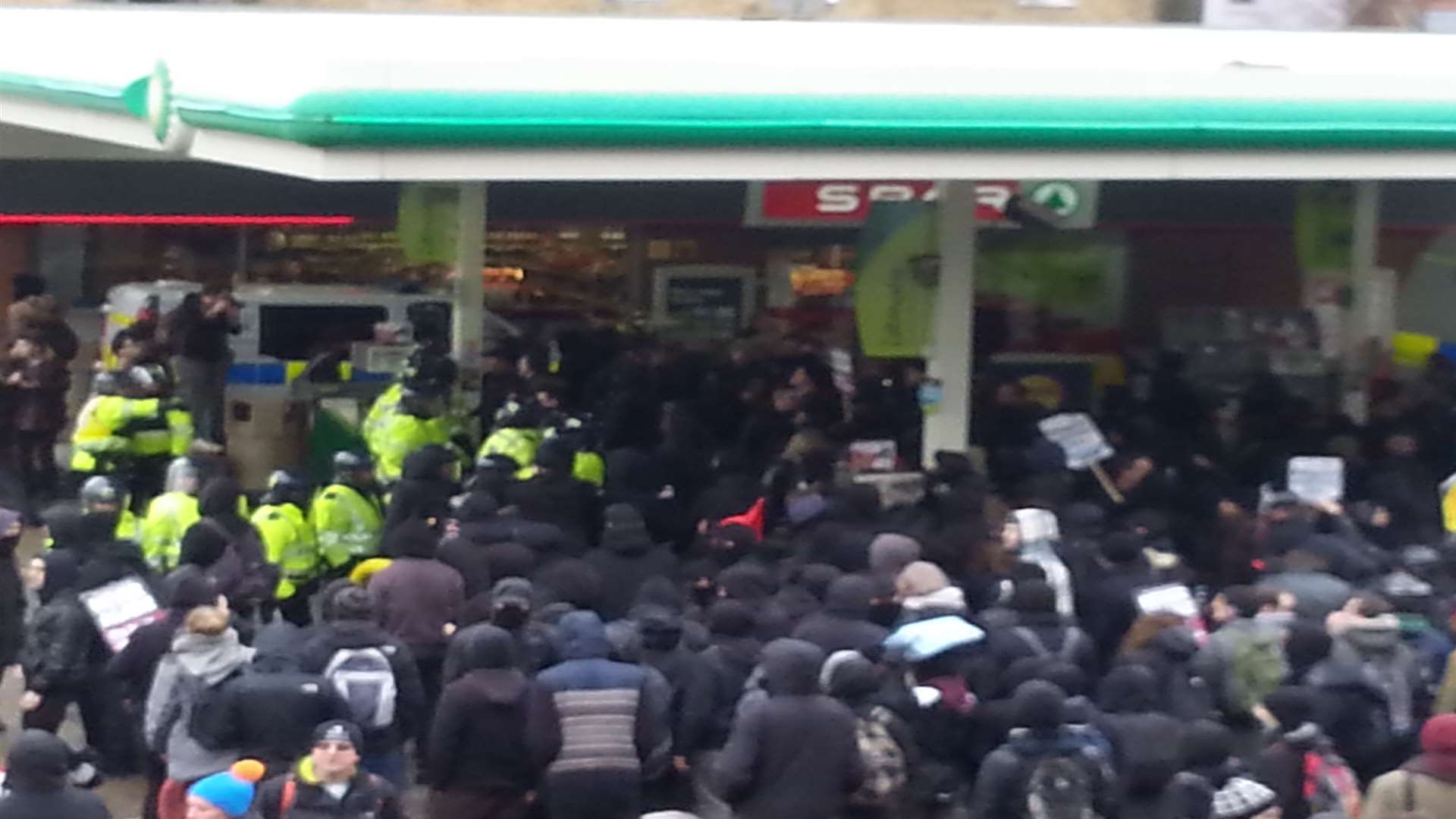 Protesters swamp the petrol station at the junction of Folkestone Road and Effingham Street, and police move in, January 30.