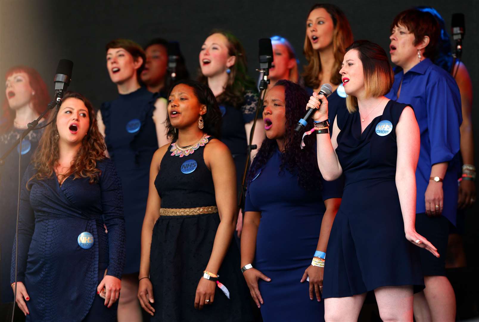 The Lewisham and Greenwich NHS Choir, pictured performing at the Glastonbury Festival, sang a carol during the Queen’s address (Yui Mok/PA)