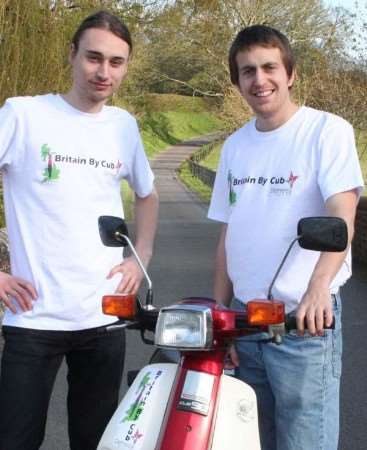 Aaron Thompson, left, and George Luckhurst, who are travelling the coast of Britain on pizza delivery bikes