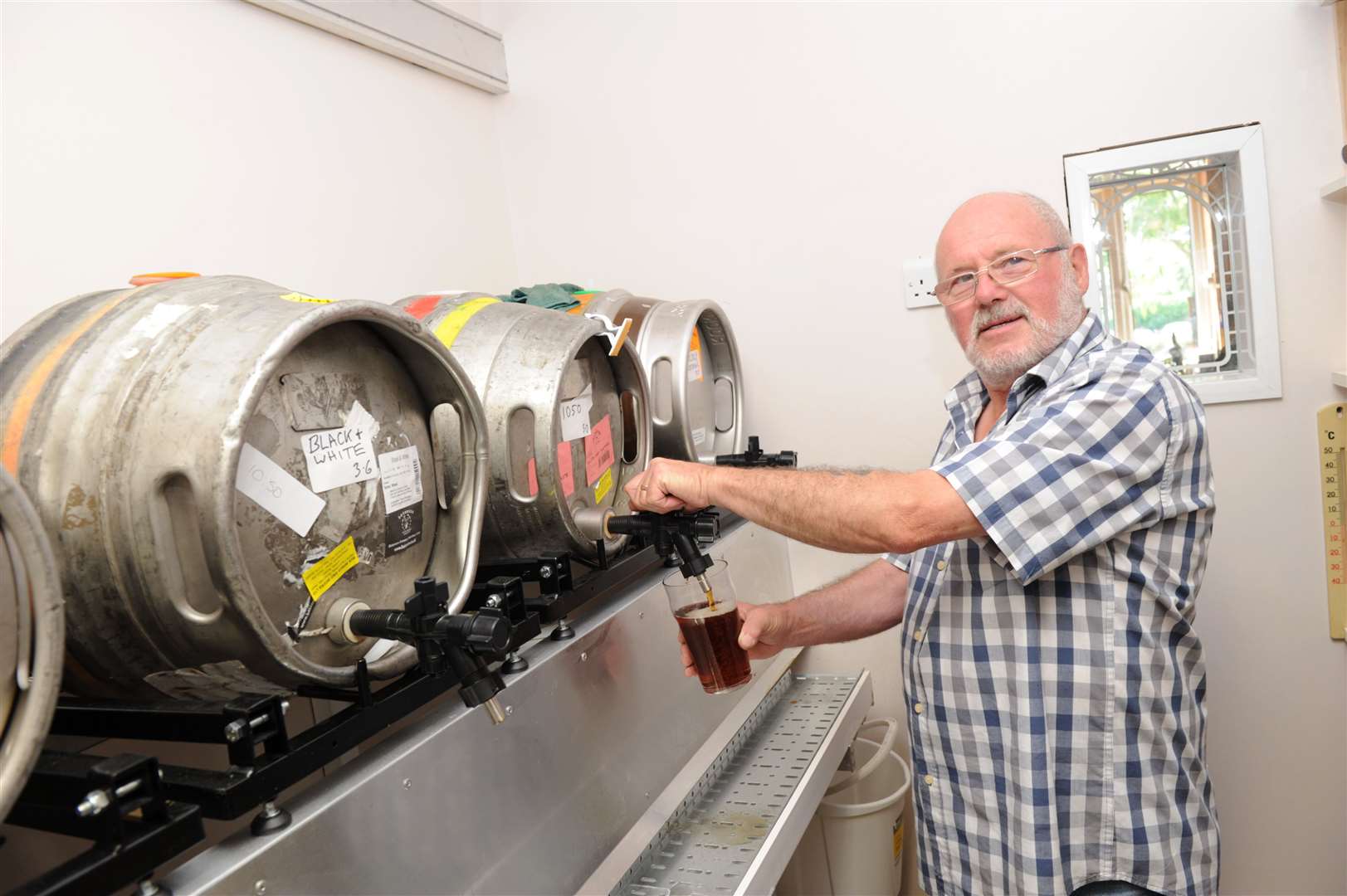 The 10:50 from Victoria owner Bob Jackson pouring a pint after the pub opened in 2015