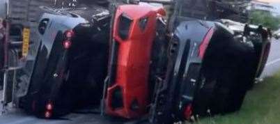 Hundreds of thousands of pounds worth of cars have been damaged after a car transporter overturned. Picture: Ben Slipper
