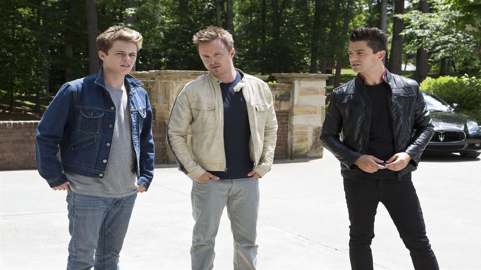 Dominic Cooper as Dino Brewster, Harrison Gilbertson as Little Pete and Aaron Paul as Tobey Marshall, in Need For Speed. Picture: PA Photo/Entertainment One