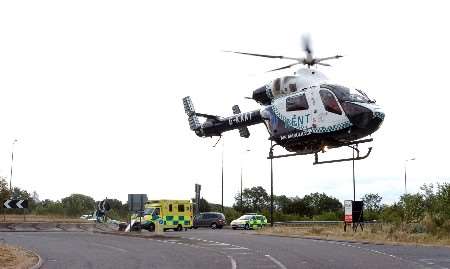 Kent Air Ambulance takes off from the scene of the accident. Picture: MATT WALKER