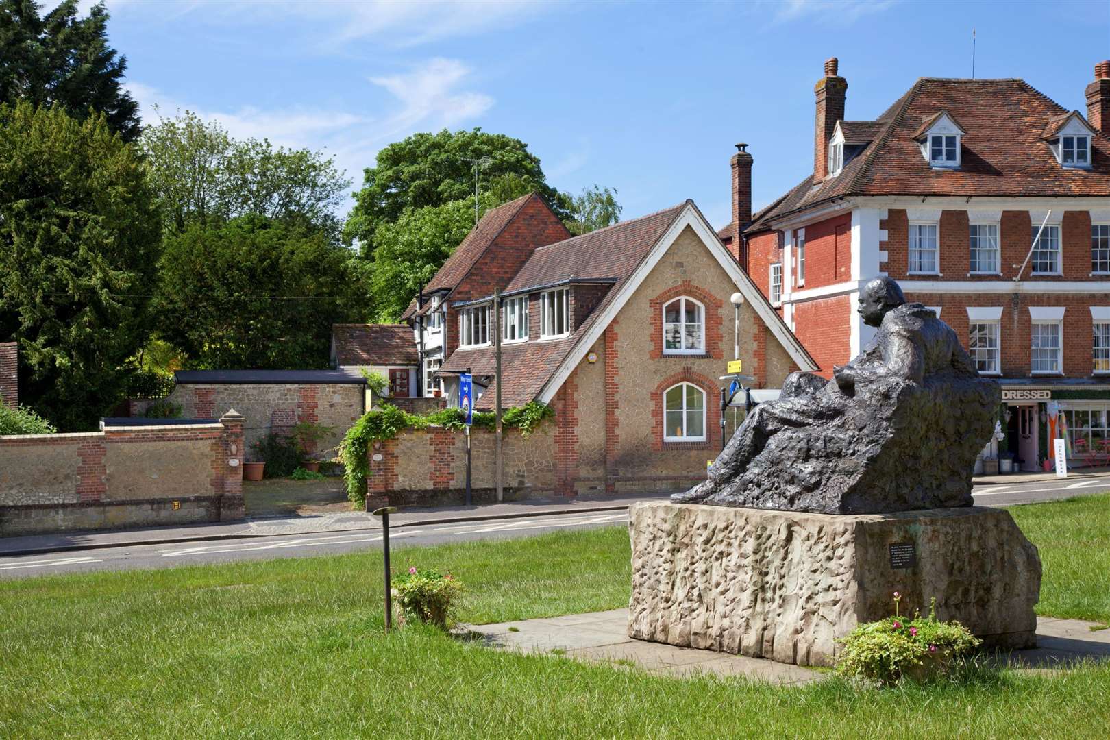 Churchill's statue in Westerham with the Owl House behind