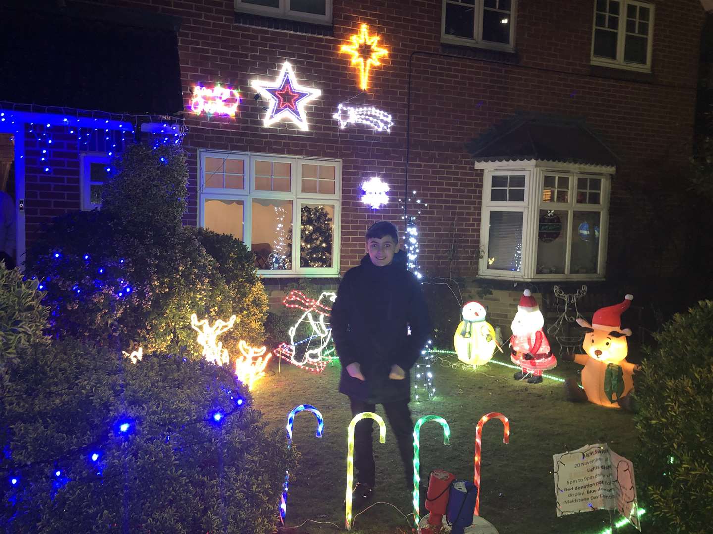 Callum Dunne stands with his Christmas light creation (24534471)