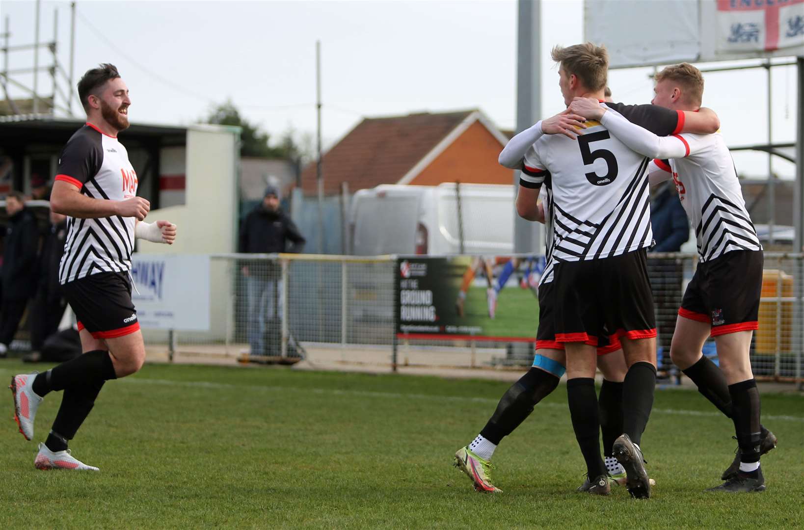 Scorer Connor Coyne joins Alex Green, who supplied the cross for the winner, to celebrate with team-mates Kane Smith and Tom Chapman in Deal's 1-0 weekend win over Rusthall. Picture: Paul Willmott