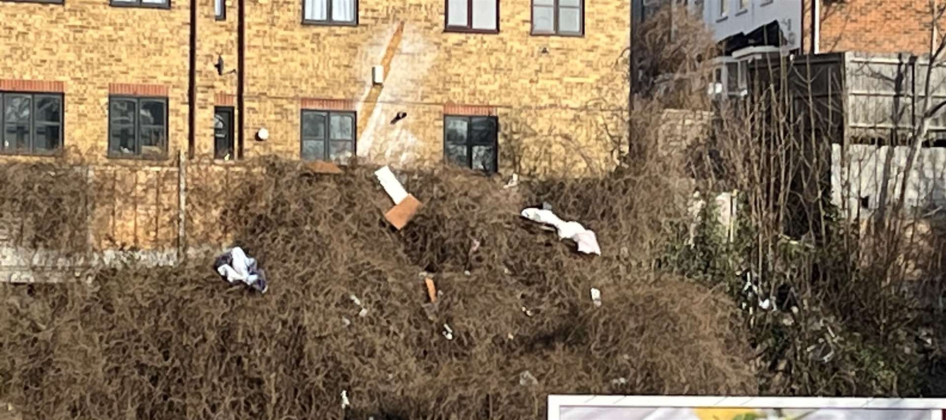 Fly-tipping down a bank close to Luton Arches, in Chatham