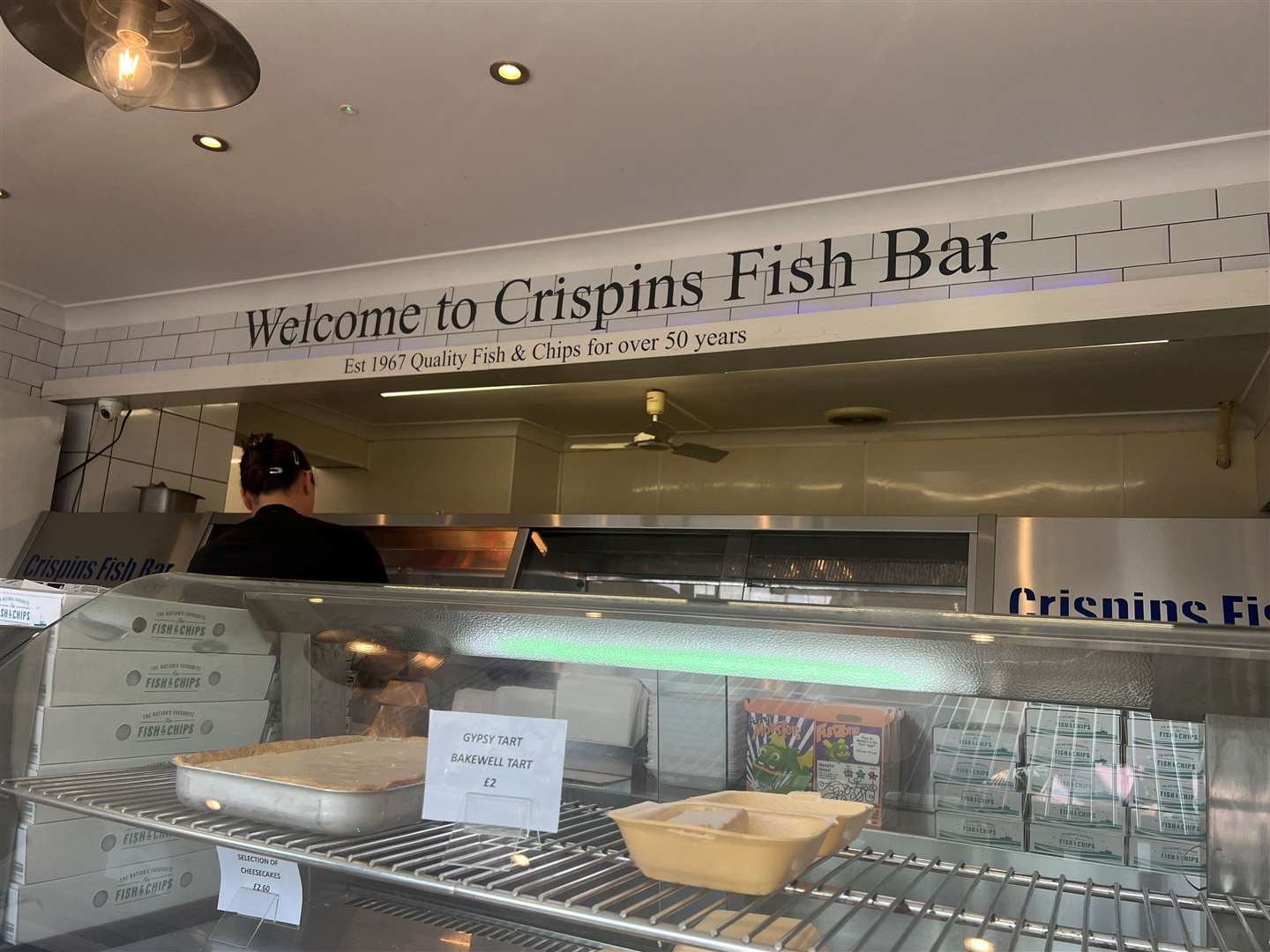 Emily Stanley behind the counter at Crispins Fish Bar in Teynham. Picture: Megan Carr