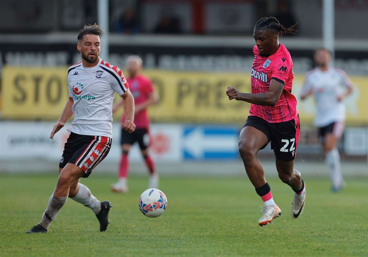Shad Ogie challenges for the ball for Gillingham at Hereford Picture: @Julian_KPI