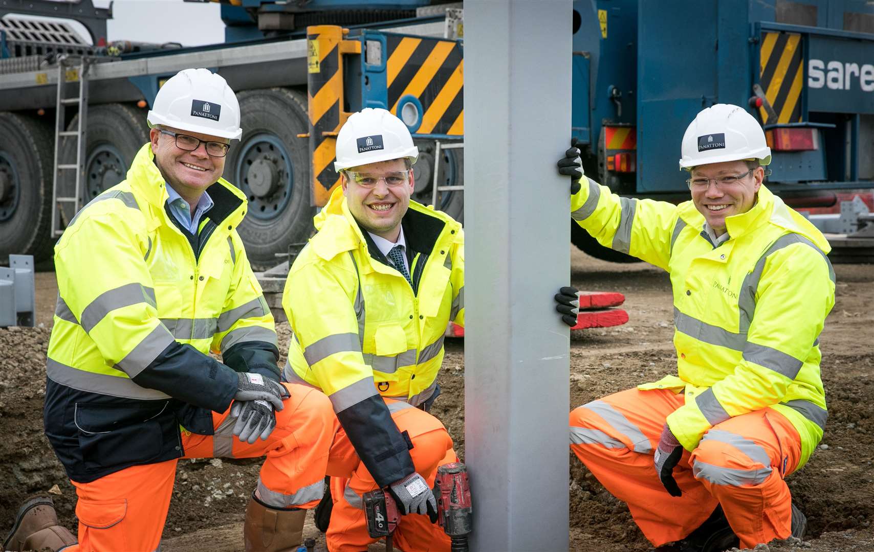 The first steel frames are inserted at the former Aylesford Newsprint site: from left, Tony Watkins, Cllr Matt Boughton and project delivery director Simon Willgress