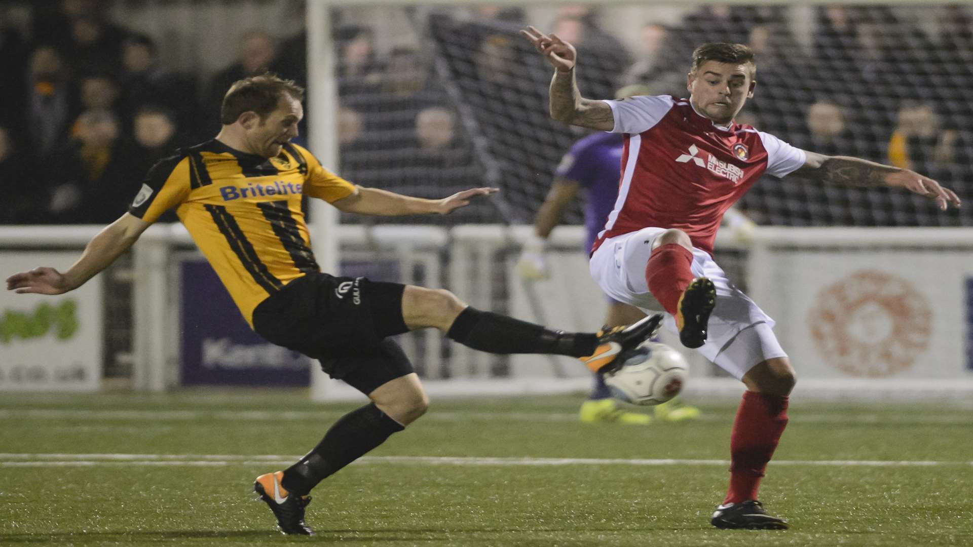 Maidstone's Stuart Lewis and Ebbsfleet's Sam Magri do battle Picture: Andy Payton