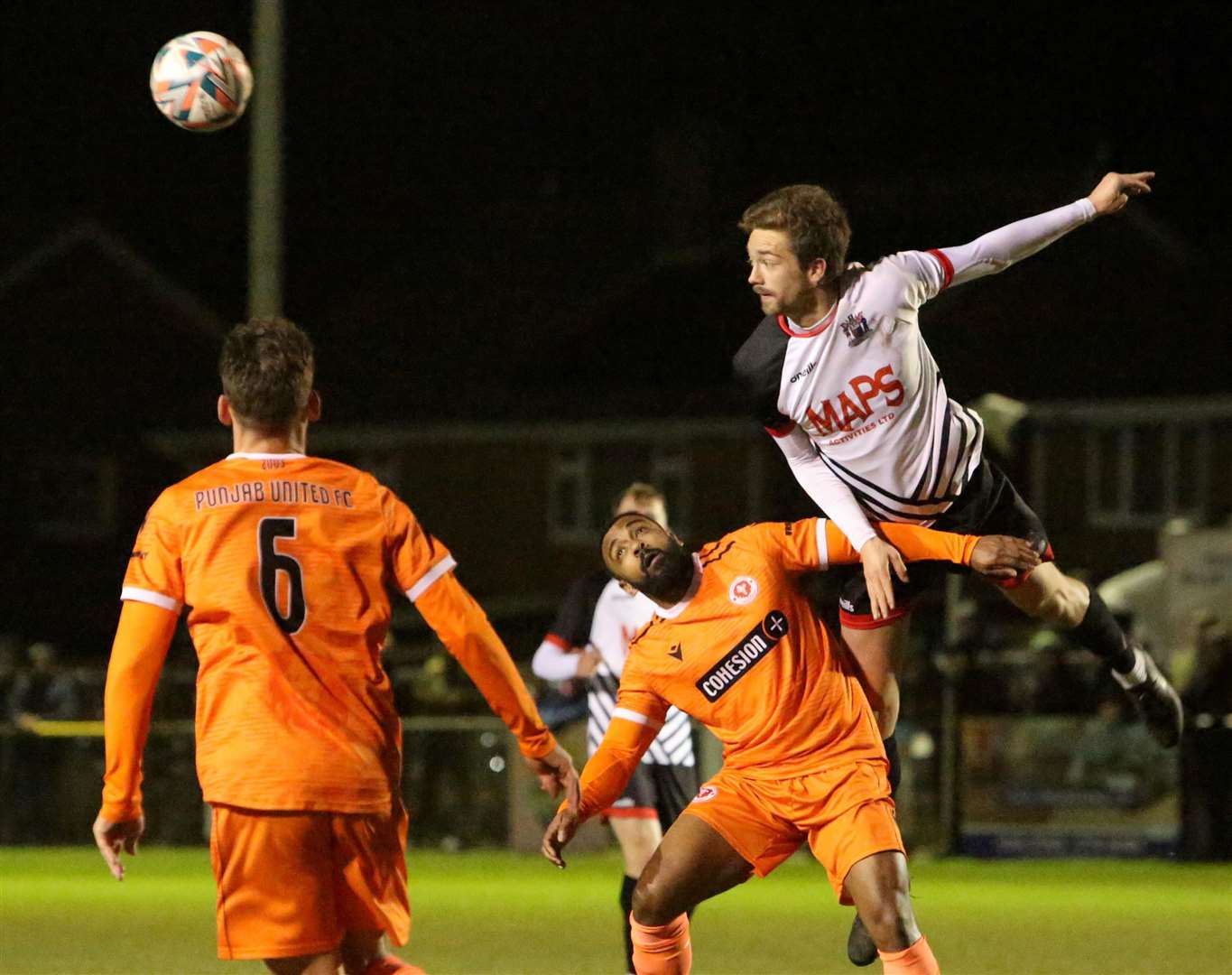 Scorer Billy Munday climbs above the Punjab United defence. Picture: Paul Willmott