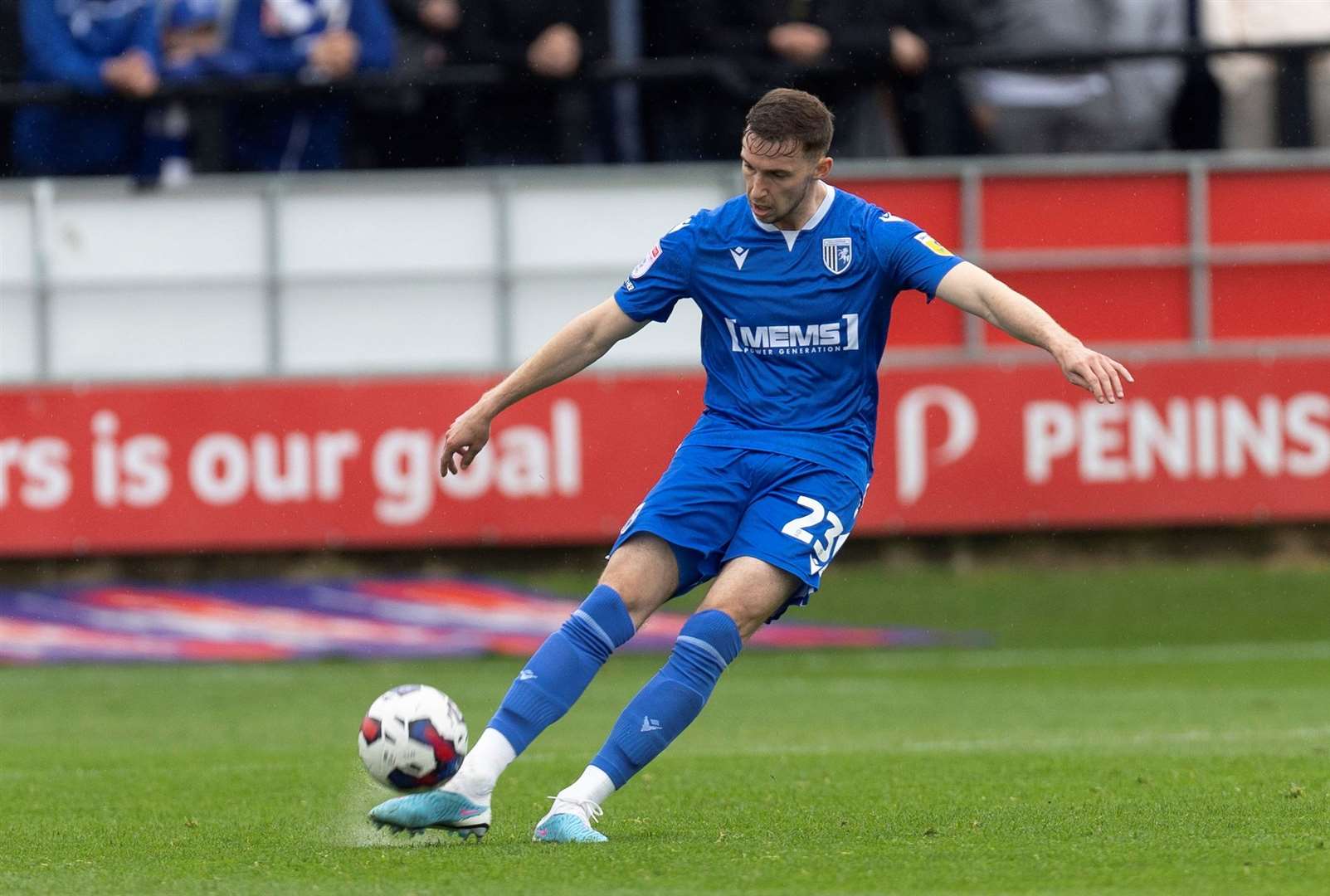Conor Masterson in action for Gillingham against Salford City on Monday
