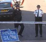 TAPED OFF: Police at the scene of the doorstep attack. Picture: JIM RANTELL