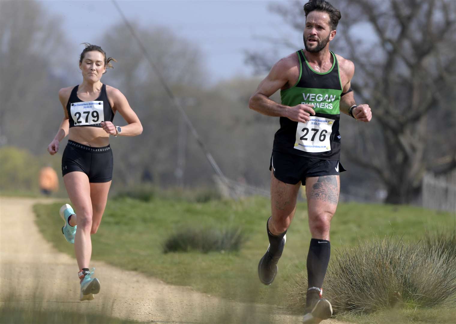 Thanet Road Runners member Abigail Cardwell, who was the first female to finish, closes in on Dean Evans who finished 11th. Picture: Barry Goodwin