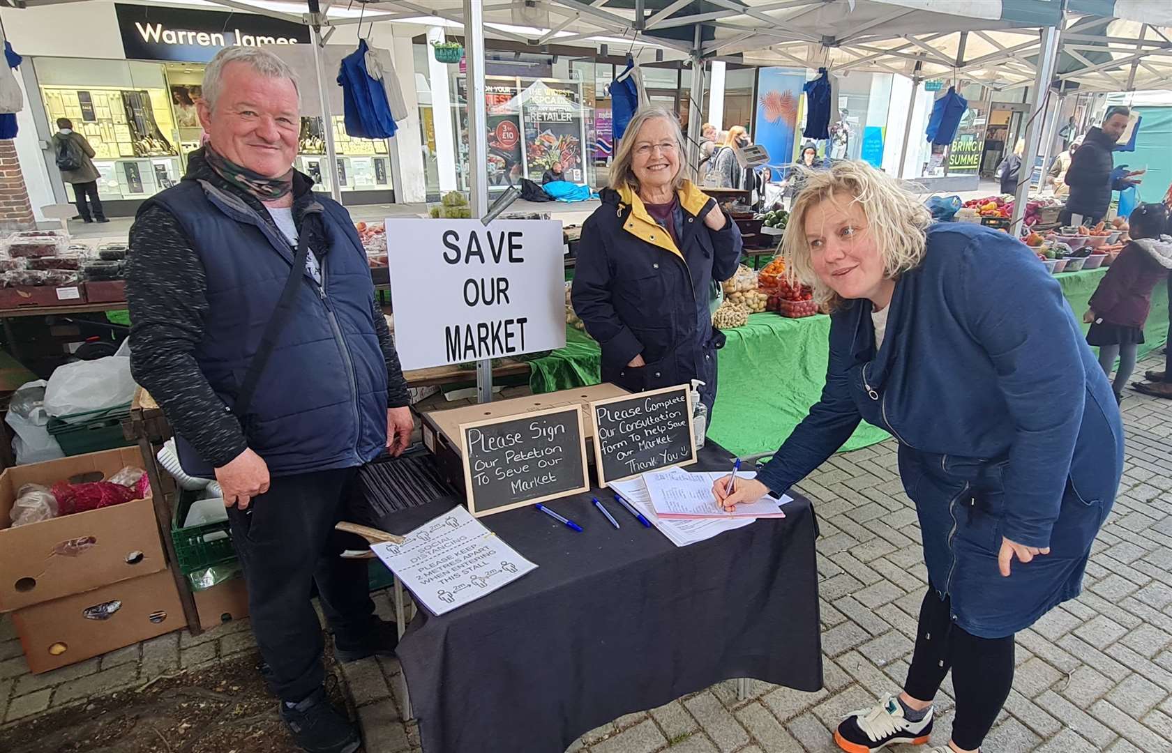 Cllrs Mel Dawkins and Pat Edwards, pictured with market association chairman Steve Bamber, are backing the traders' bid to stay