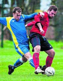 Oakwood FC (red) in action against Sheerness East