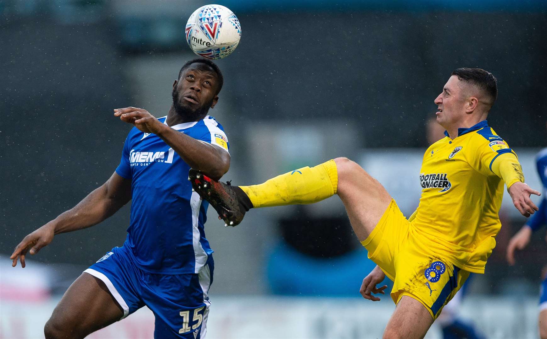 John Akinde battles in vain as Gills' 15-game unbeaten run came to an end at the hands of AFC Wimbledon Picture: Ady Kerry