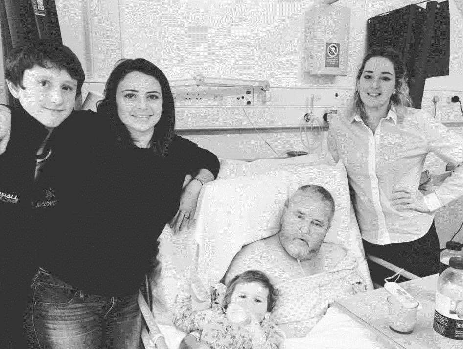 Clive Singleton in hospital with son Jake, daughter Alex, grand-daughter Aurora and daughter Samantha. Picture: Brain Tumour Research