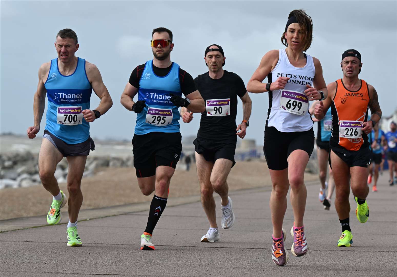 Thanet Roadrunners' Phil Stevens (No.700) and clubmate Daniel Grech (No.295) chase Petts Wood Runners' Emma Stevens (No.699). Picture: Barry Goodwin