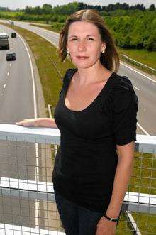 Rachel Rook, who lost her father in an accident on the A249 in 2002, stands on the Grovehurst Bridge over the busy road.