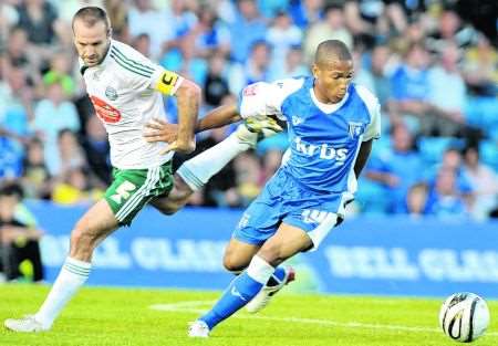 Gillingham forward Simeon Jackson gets away from his marker against Plymouth