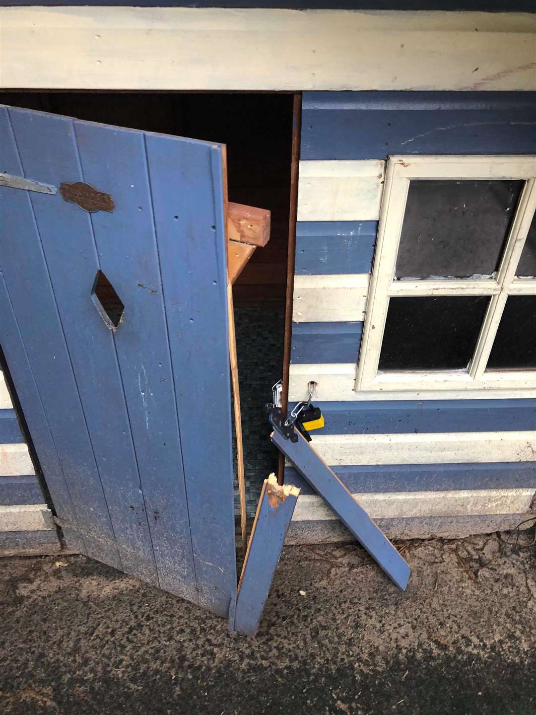 The children's playhouse had it's door broken and windows smashed (3712405)