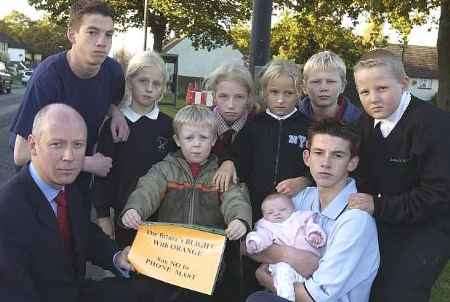 CONCERNED: MP Jonathan Shaw with some of the youngsters who live near the mast
