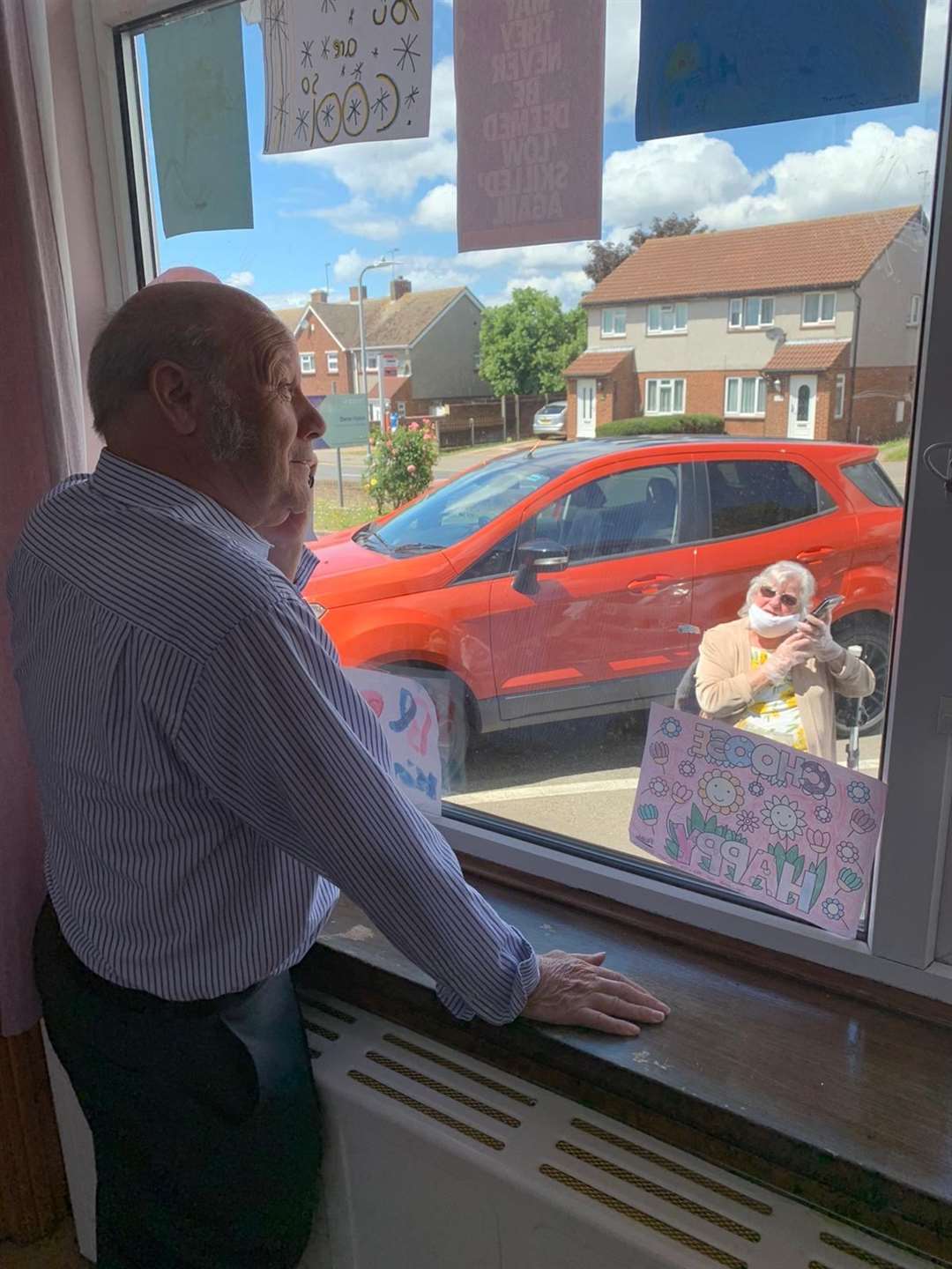 Stan was over the moon to receive a window visit from his wife and daughter