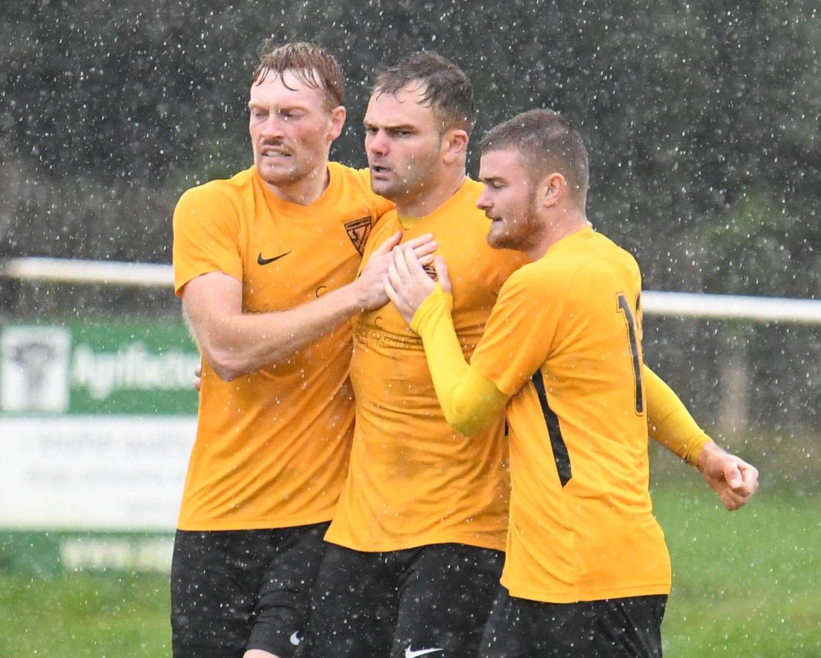 Gary Lockyer, centre, is congratulated by Kennington team-mates after scoring in the win at Rusthall Picture: Paul Davies