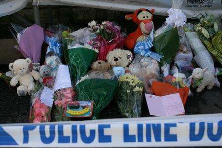 Floral tributes at scene of fatal house fire in Chatham Hill