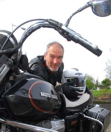 Alasdair Bruce with his Motoguzzi motorcycle