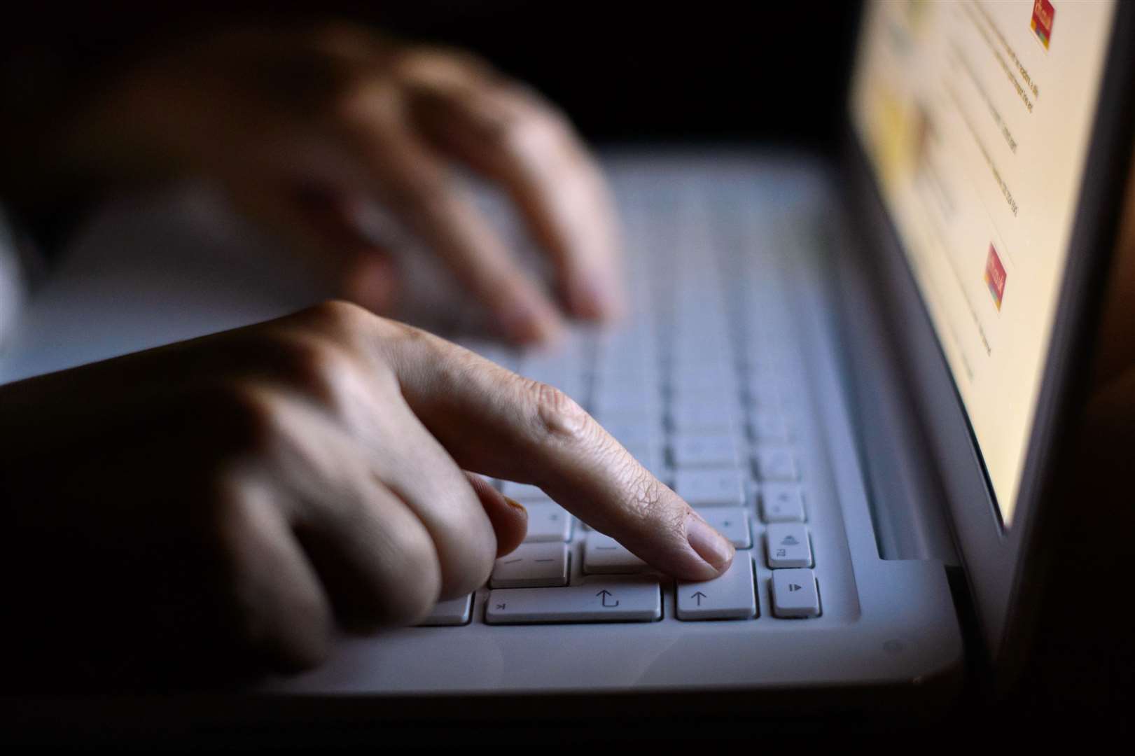 Police found a laptop containing indecent images of children hidden behind a toilet