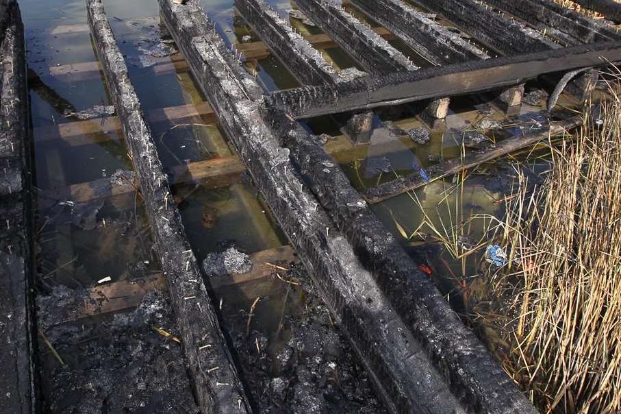 The burnt out jetty at the fishing lake