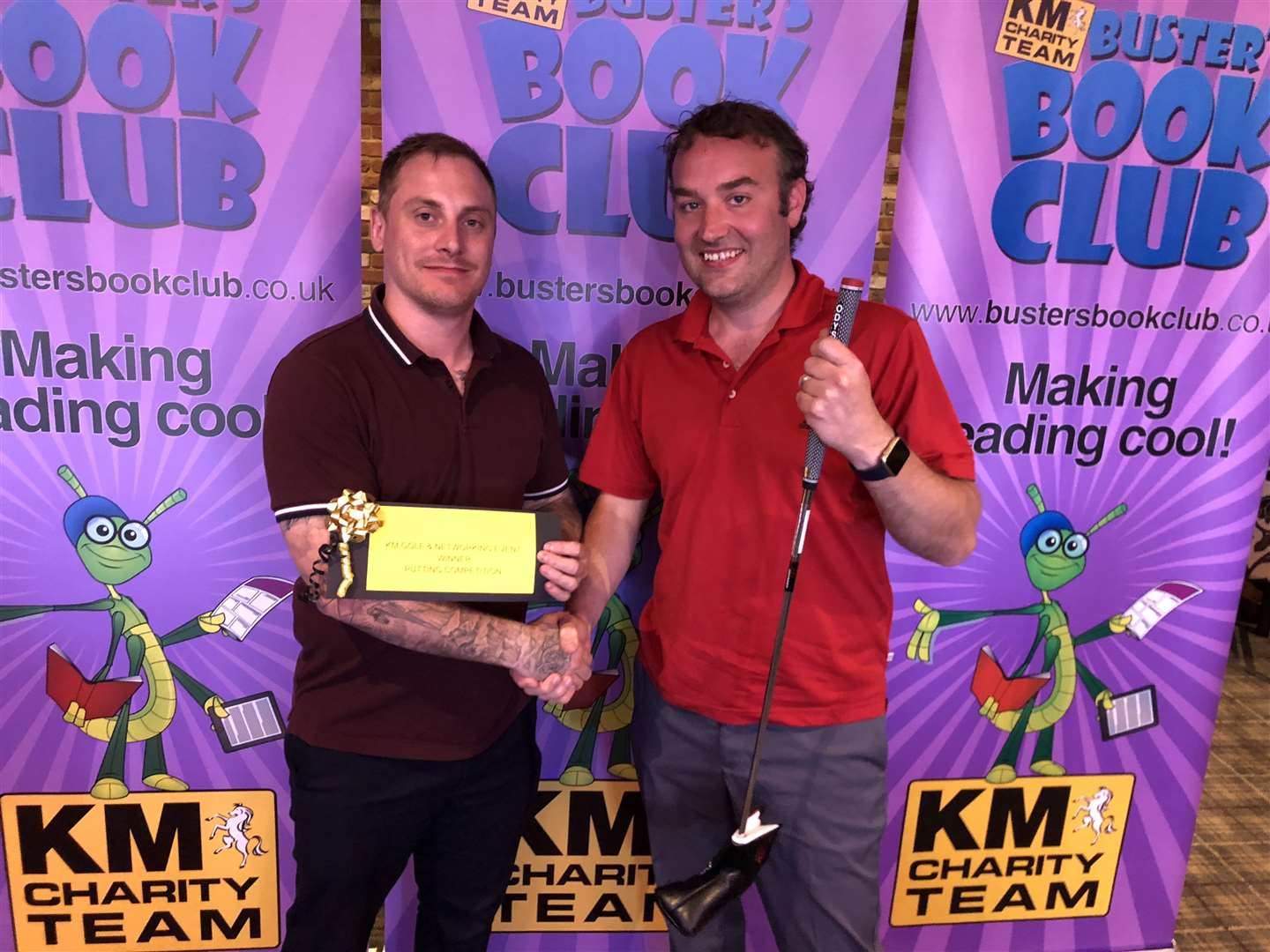 Jason Raggatt (left) from Barclays presents Karl Smith with the prize for winning the putting competition at the KM Charity Golf Challenge. (1959197)
