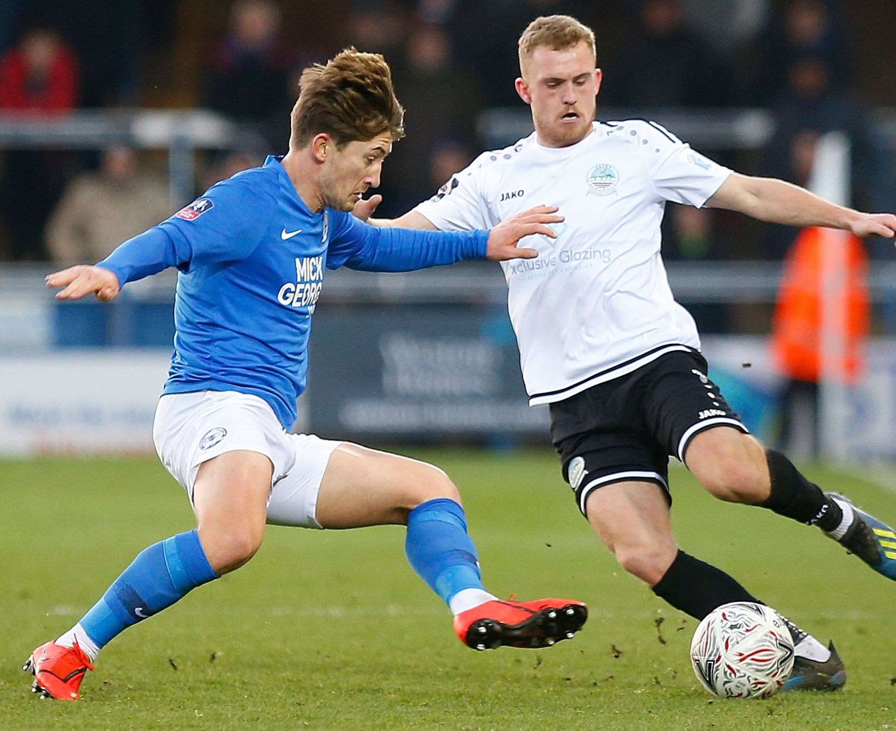 Dover's Bobby-Joe Taylor takes on Peterborough's Alex Woodyard Picture: Andy Jones.