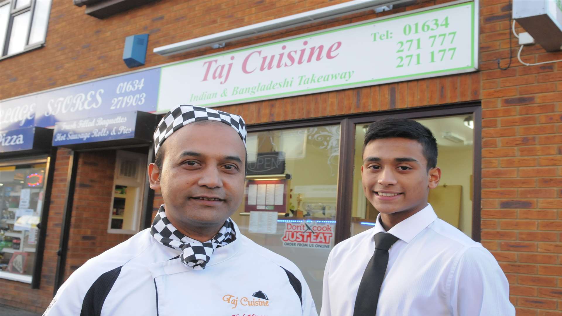 Abul Monsur with his son Rahath Monsur, outside the Taj Cuisine which is ready for Christmas