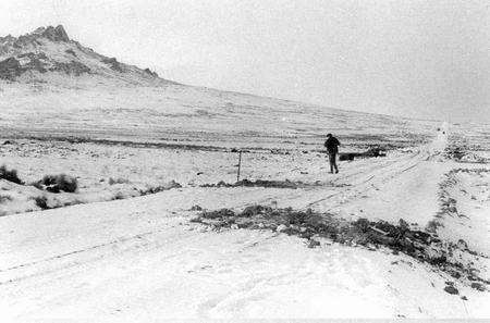 Major Guy Lucas of BACTEC International, Medway City Estate, surveys the scene on the Darwin-Goose Green Road on the Falklands soon after the Argentinian surrender in 1982