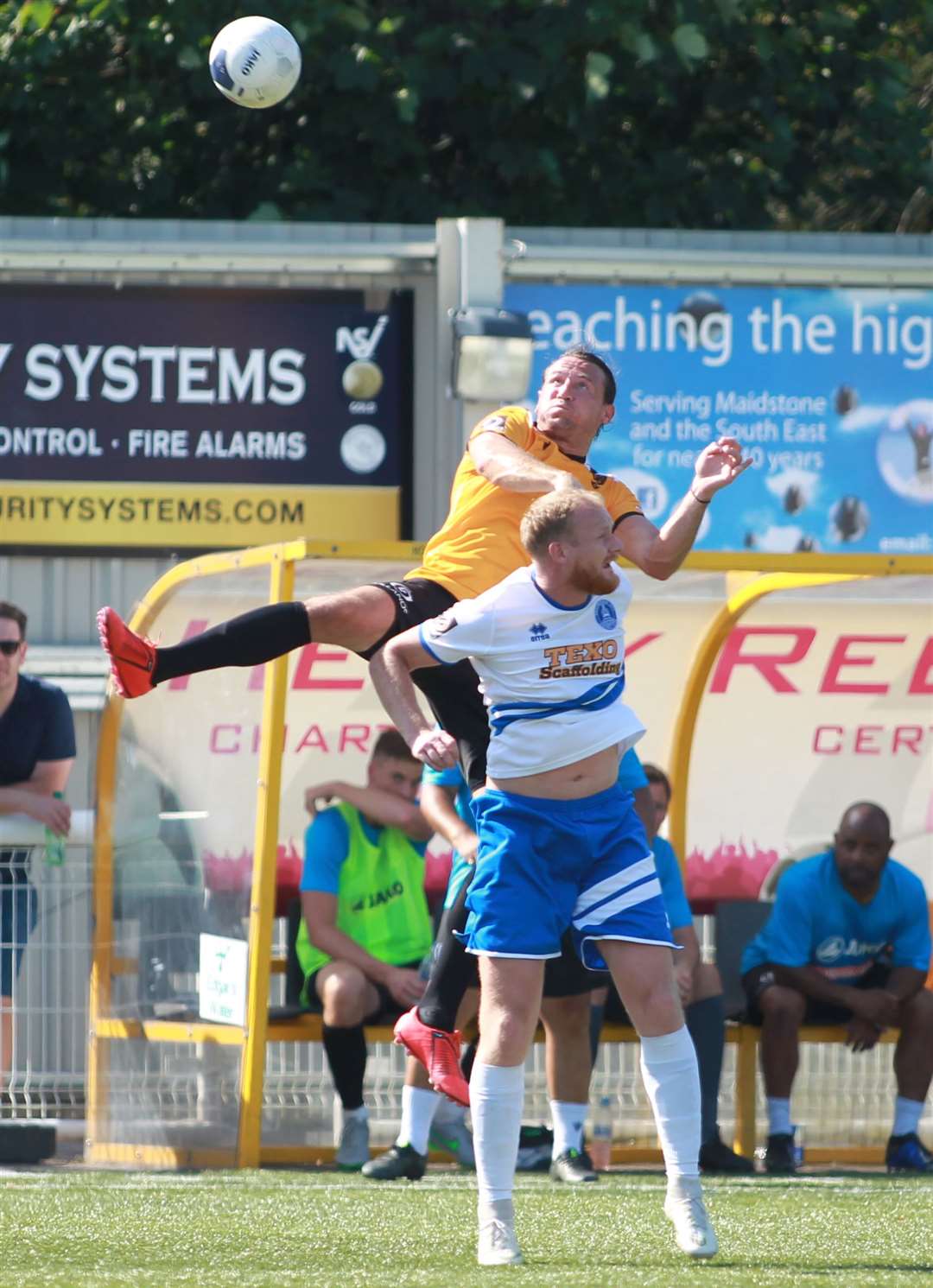 Maidstone United defender Ryan Johnson towers above his man against Chelmsford Picture: John Westhrop