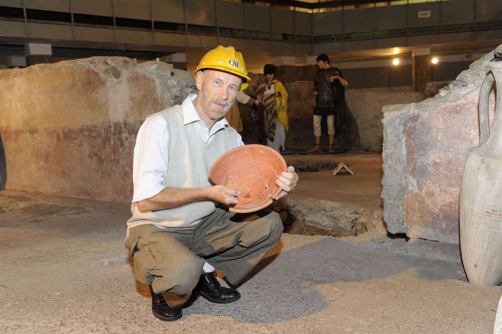 Dr Brian Philp with a Roman bowl found on the site of the Roman Painted House in Dover